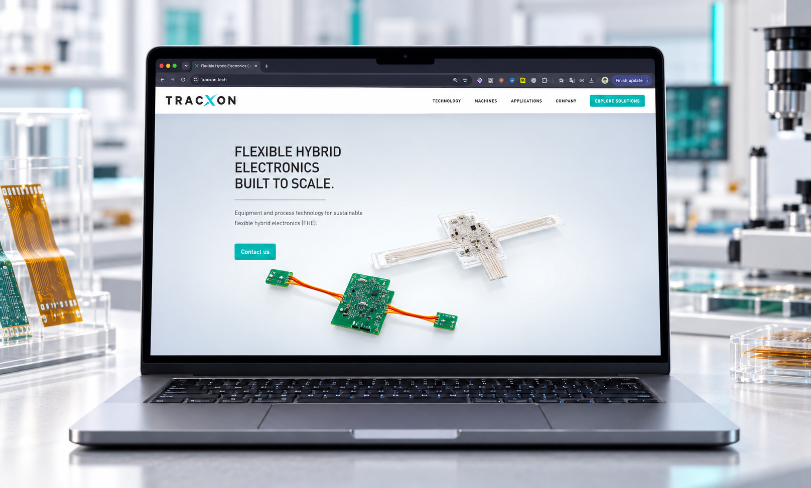 The TracXon website on a laptop in a lab