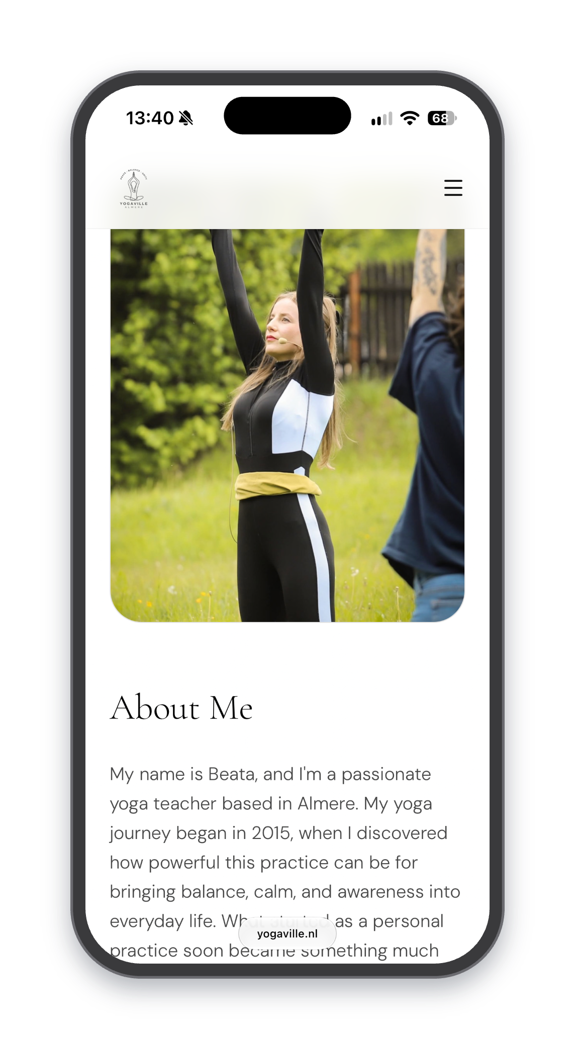 Yogaville website on a phone